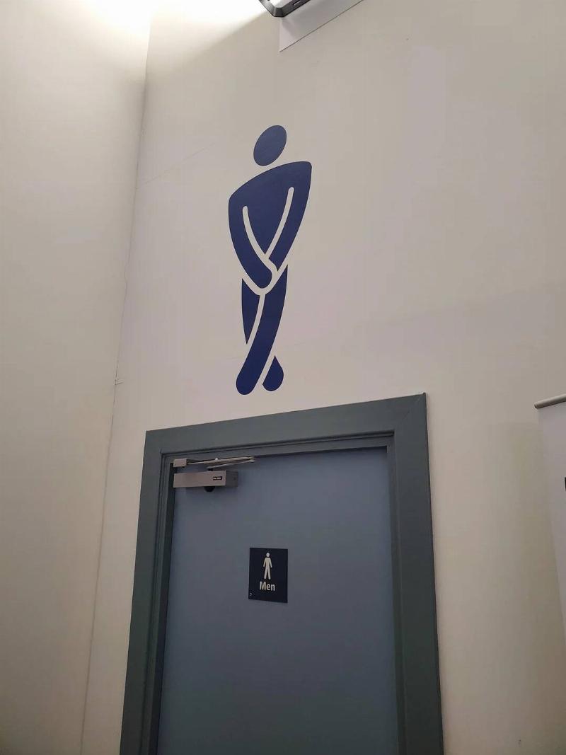 the-sign-above-the-mens-toilets-inverness-airport-departure-v0-f8120ll3k7ve1