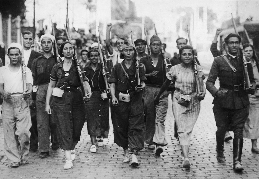 Male and female militia fighters on the march at the beginning of the Spanish Civil War