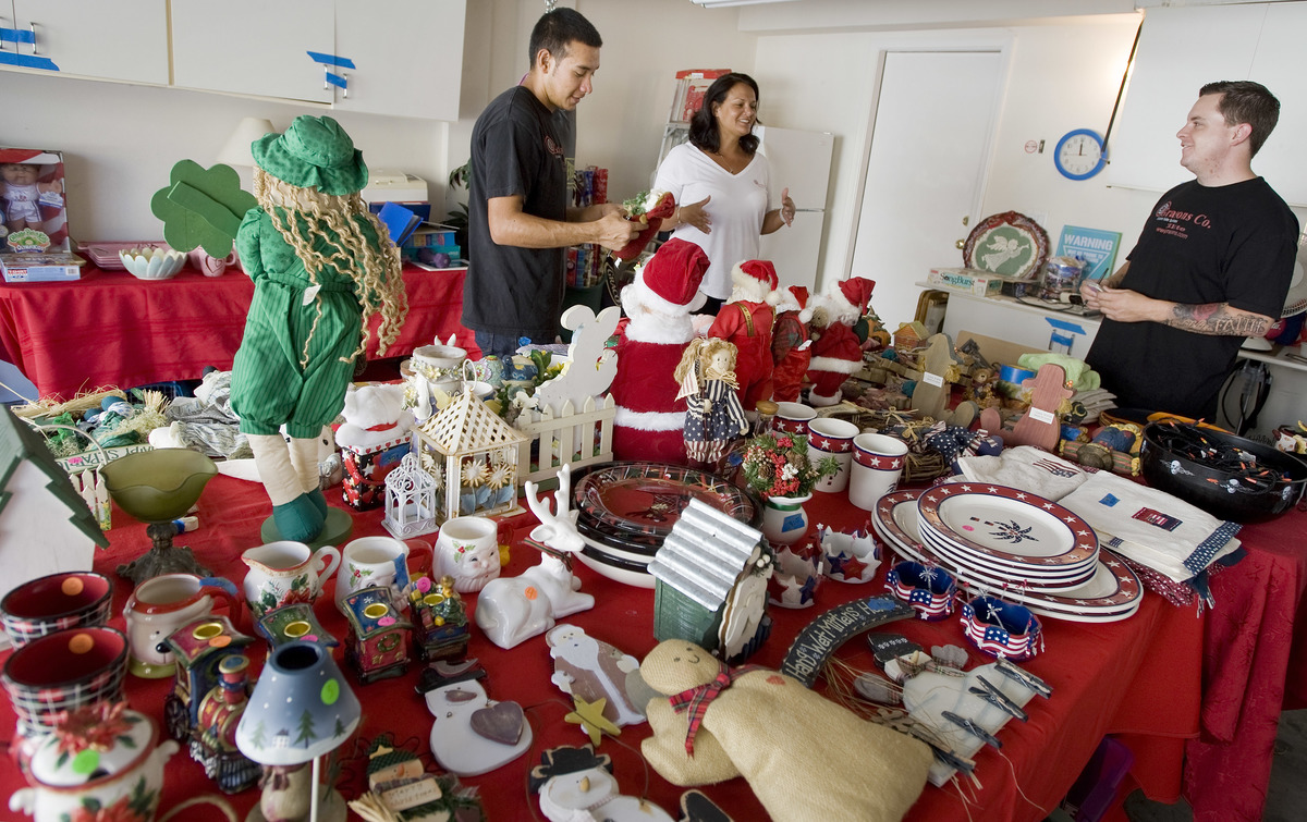 Knickknacks fill the garage in Ladera Ranch where workers prepare for an estate sale.