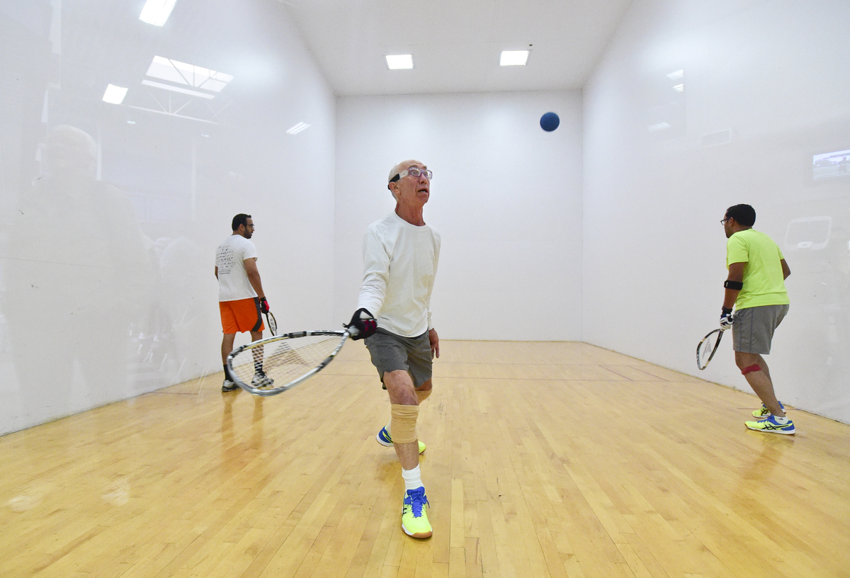 Sandeep Reddy, of Longmont, Chris Hawley, of Longmont, and Vishwanath Mantha, of Erie, play on the racquetball court at the Ed and Ruth Lehman YMCA of Longmont.