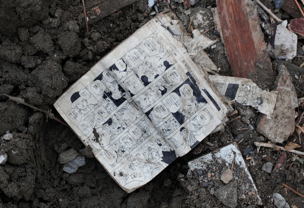 A comic book is seen amongst the rubble in Rikuzentakata, Japan.