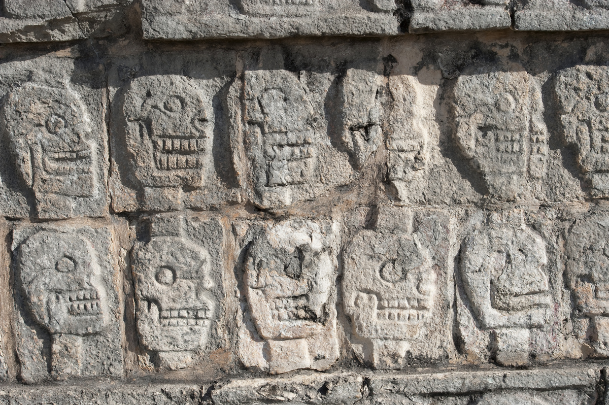 The Tzompantli, or Platform of the Skulls, carved into Mayan ruins in the Yucatan Peninsula, Mexico.