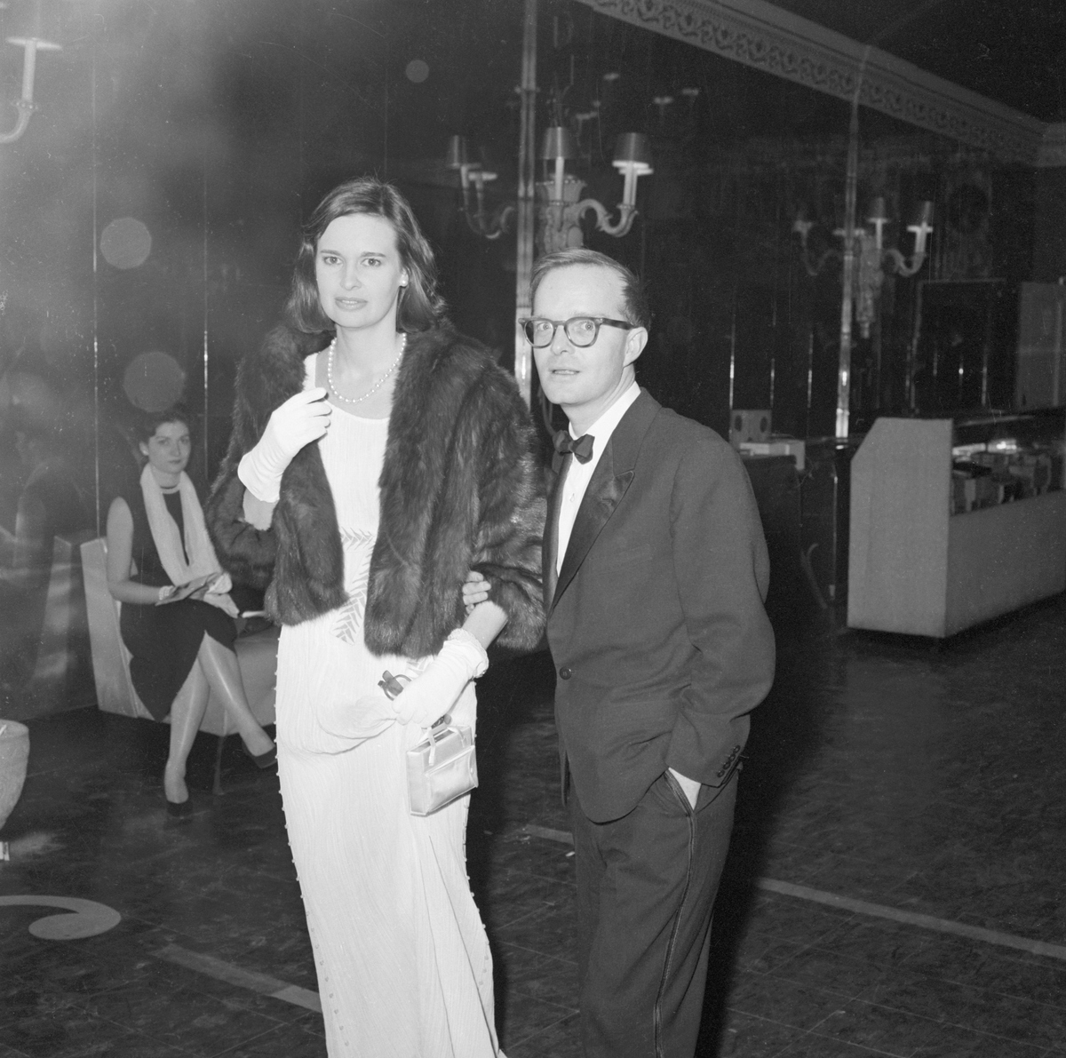 Writer Truman Capote and Gloria Vanderbilt Lumet arrive at New York's 54th Street Theatre for the opening performance of 