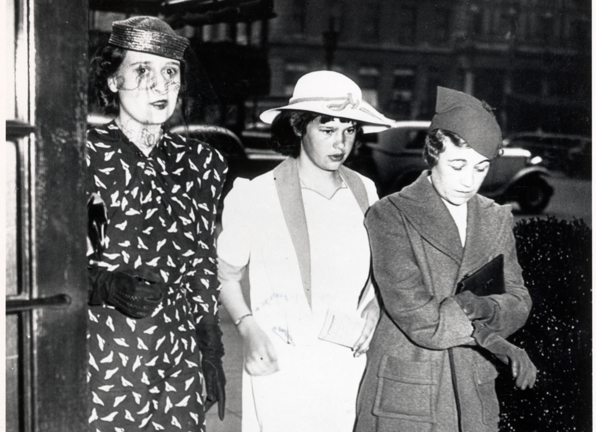 Gloria Vanderbilt is shown with her mother, Mrs. Reginald C. Vanderbilt, right, and a governess, left, as they returned to their hotel, here.
