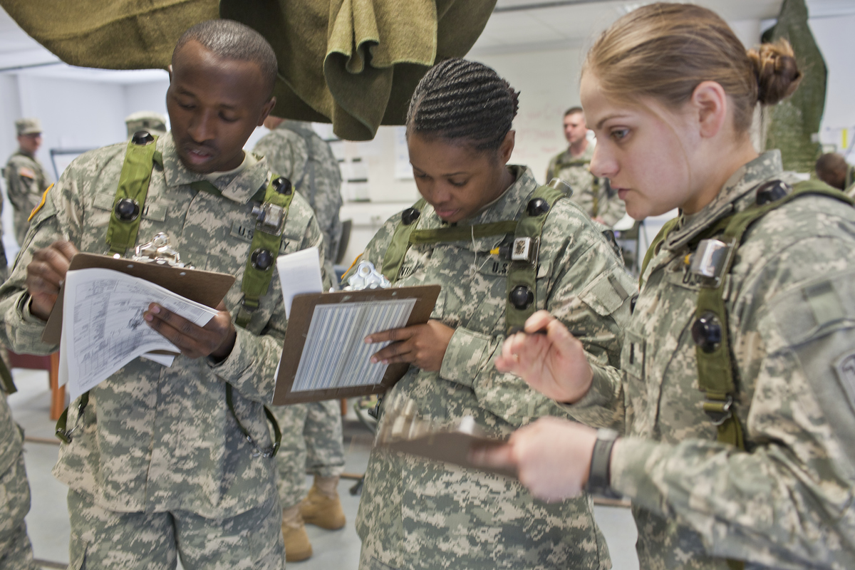 Medical assistants from the U.S. Army 172nd Separate Infantry Brigade learn to record vital data during examination of 