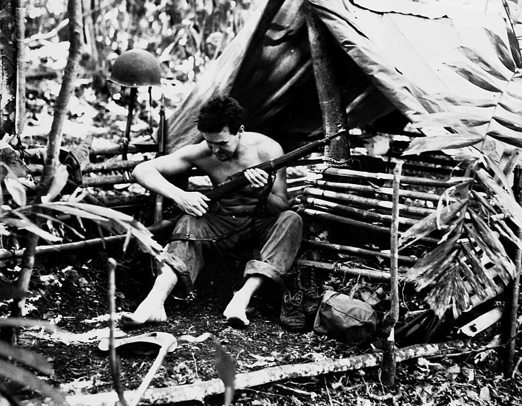 Marine  in tropical dwelling, Guadalcanal, Solomon Island