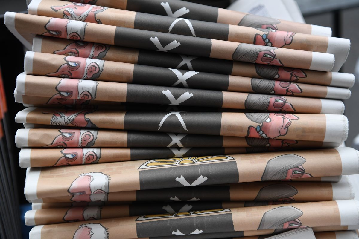 Copies of the Evening Standard newspaper, featuring cartoons of Britain's Prime Minister Theresa May and main opposition Labour Party leader Jeremy Corbyn