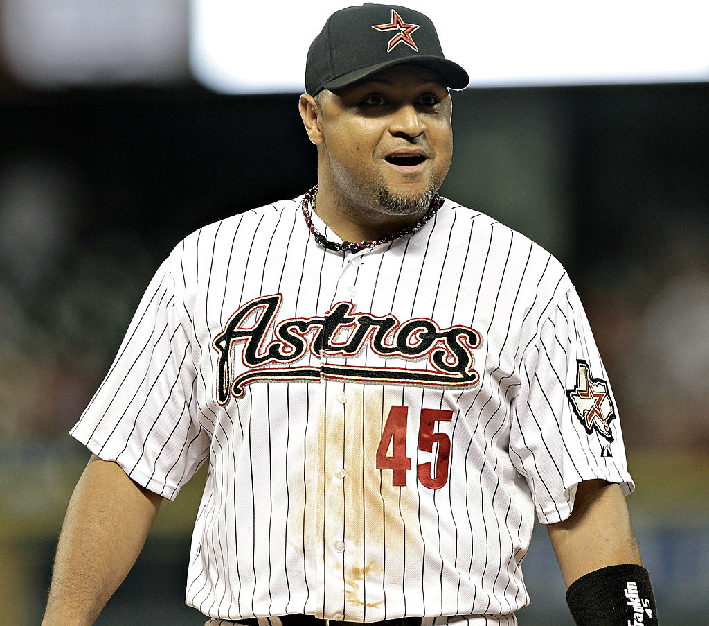Carlos Lee #45 of the Houston Astros talks with the first base umpire Brian Knight #91 at Minute Maid Park on May 16, 2012 in Houston, Texas-144642141