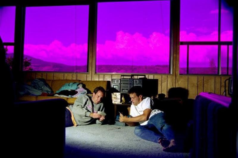 photo of friends playing cards in the cabin