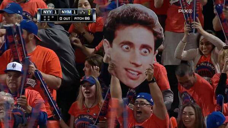 a fan with a seinfeld sign at a new york game