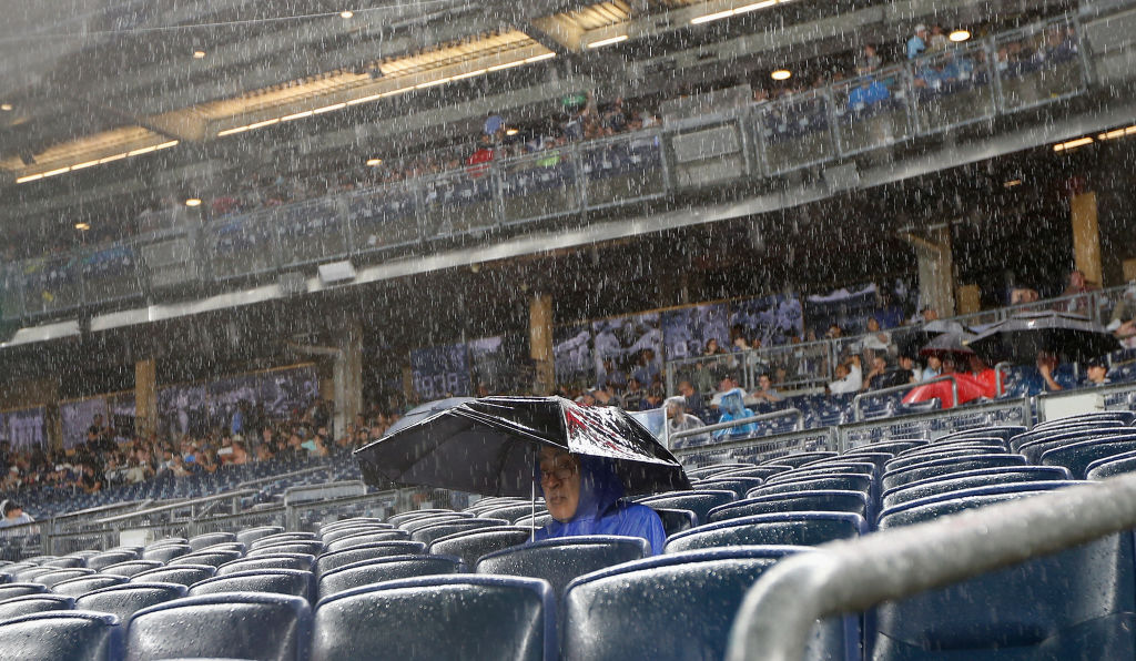 Man sitting alone in the rain 