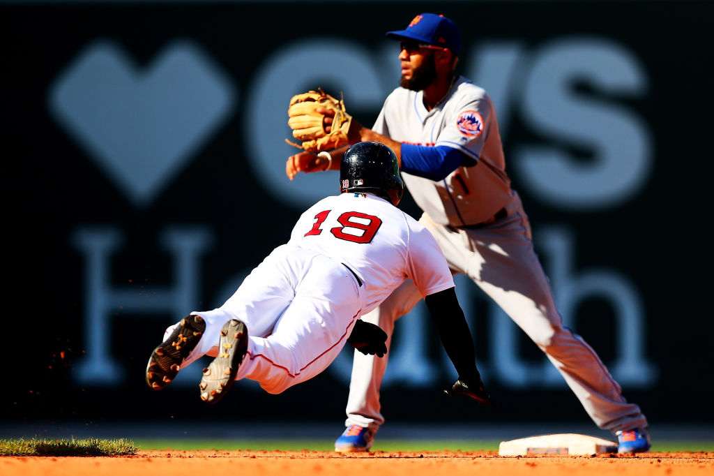 Jackie Bradley Jr. #19 of the Boston Red Sox steals second base under the tag