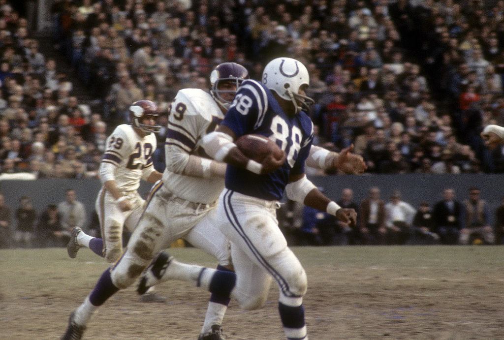John Mackey-106921900 BALTIMORE, MD - CIRCA 1965: John Mackey #88 of the Baltimore Colts runs away from Lonnie Warwick #59 of the Minnesota Vikings during an NFL football game at Memorial Stadium circa 1965 in Baltimore, Maryland. Mackey played for the Colts from 1963-71.