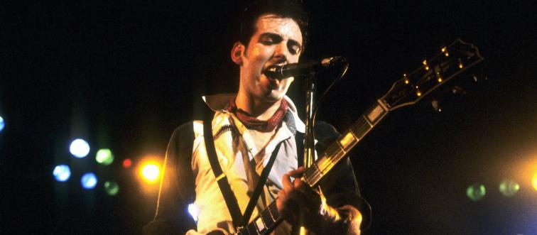 a photo of mick jones performing