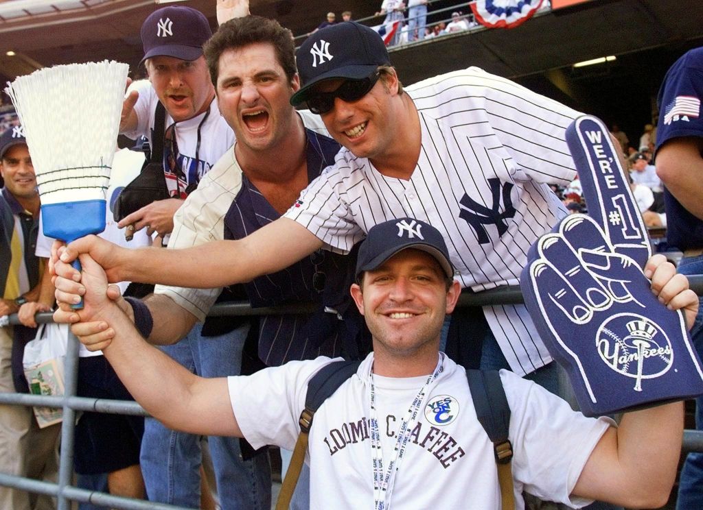 Guys holding a broom 