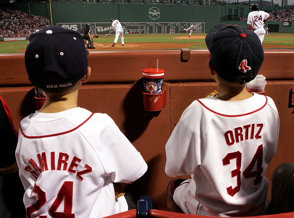 Young fans of the Boston Red Sox watch as David Ortiz #34 bats