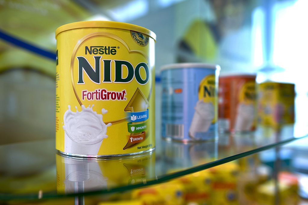 On a shelf sits Nestle powdered milk