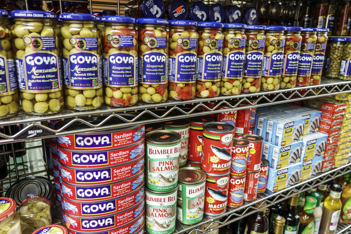 Florida, Miami, La Playa market, olives and canned seafood display.