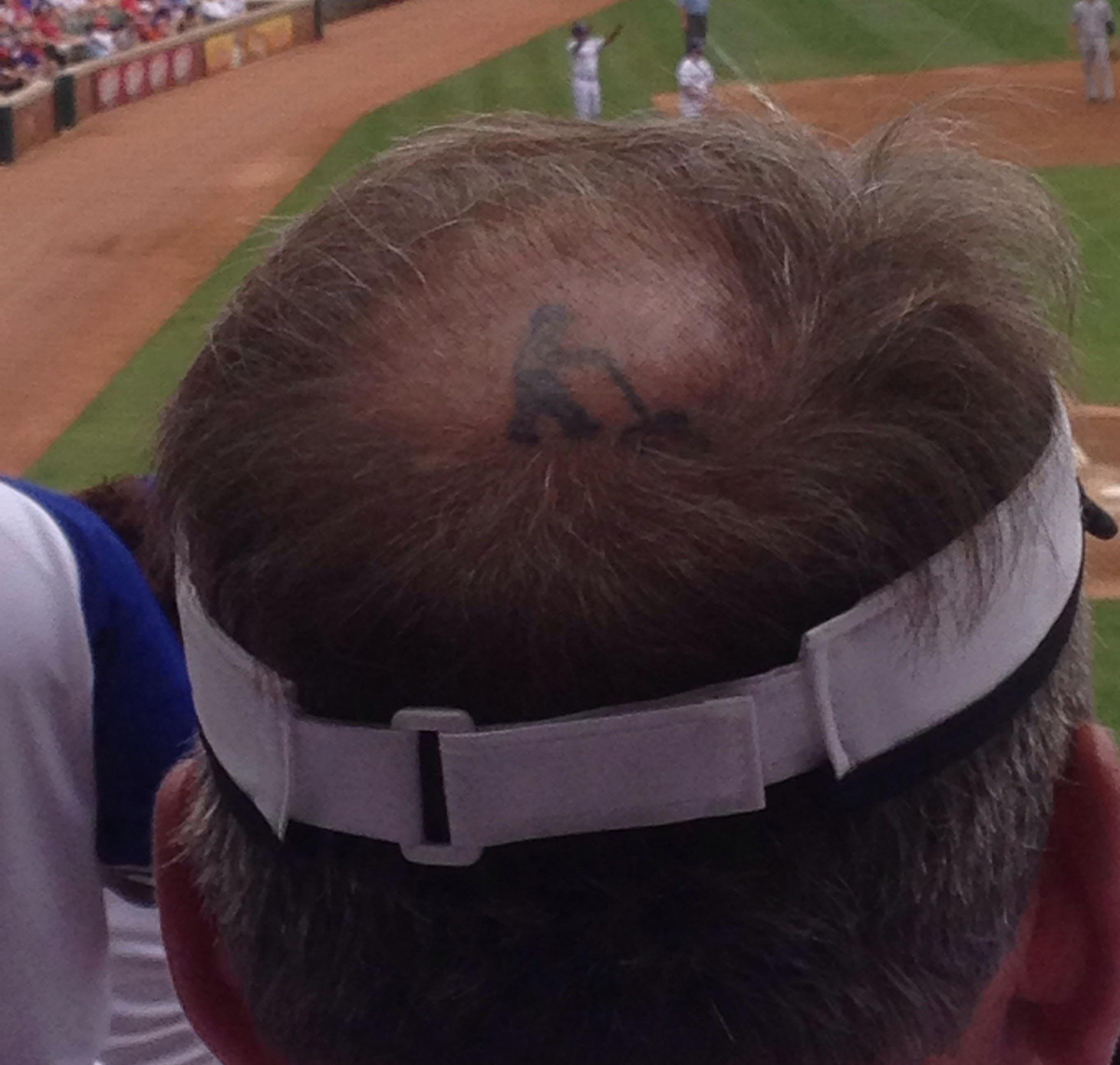 a balding baseball fan