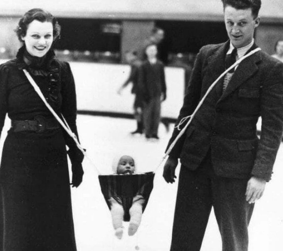 baby in slingshot ice skating