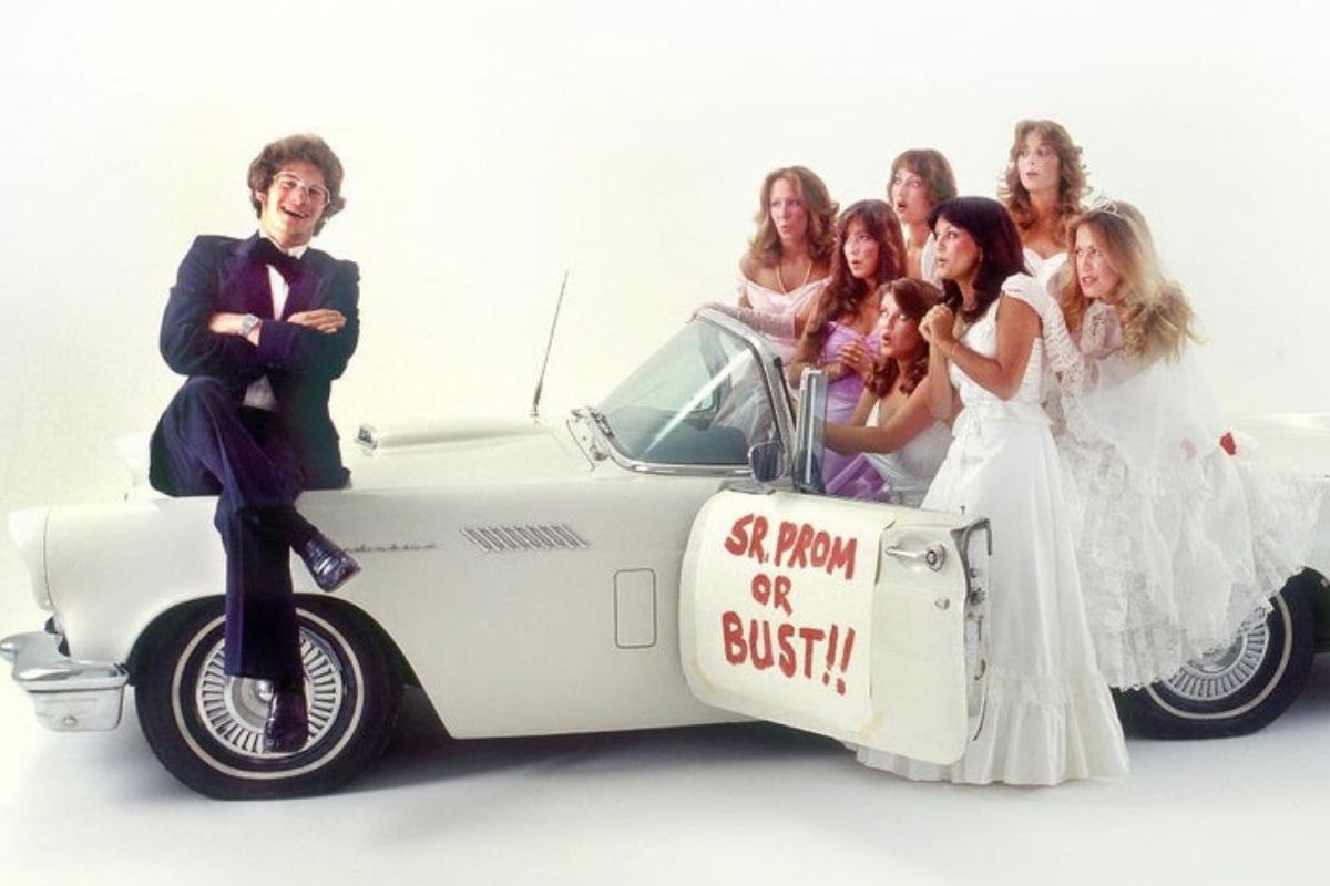 guy in vehicle laughing ladies