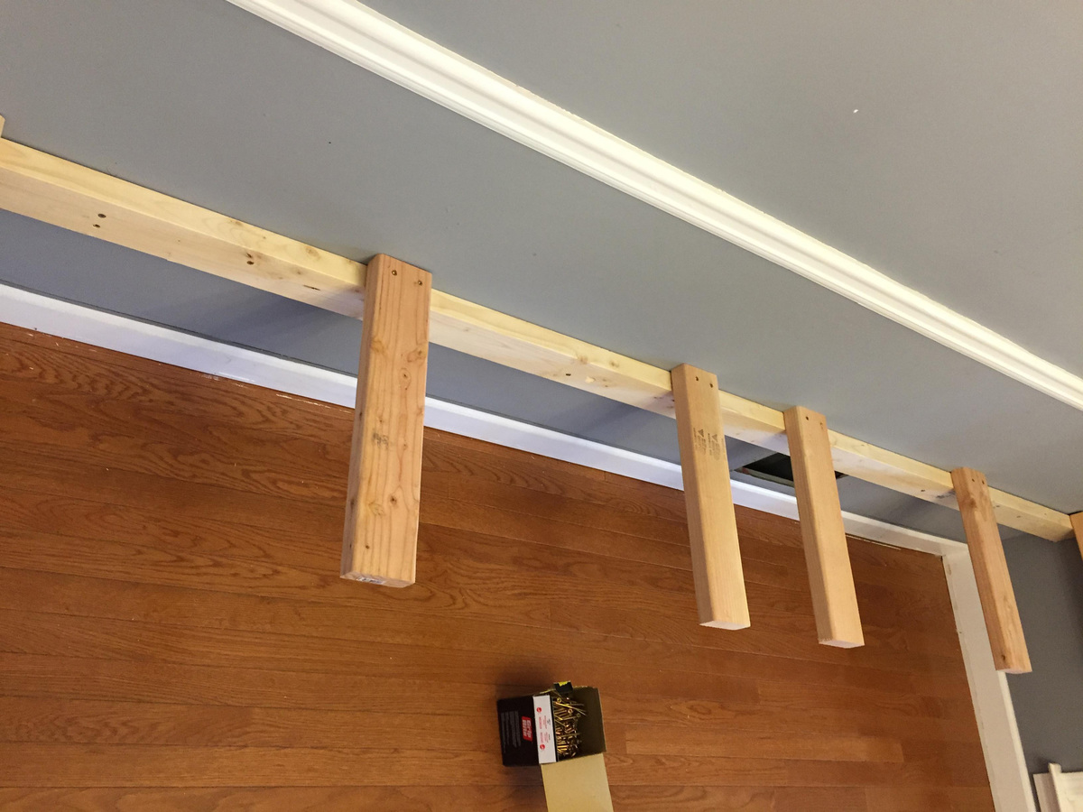 planks attatched to a beam on a wall