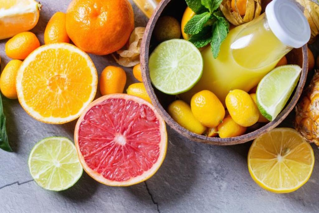 citrus 957724832 Variety of whole and sliced citrus fruits pineapple, grapefruit, lemon, lime, kumquat, clementine and physalis