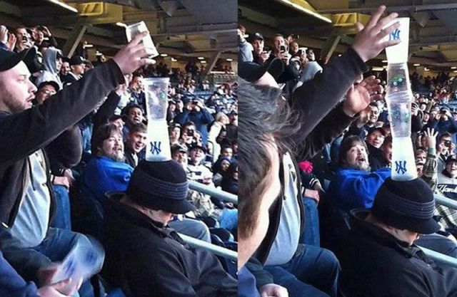 a fan asleep at a baseball game