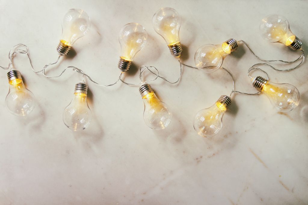 light bulbs strung out on a flat surface