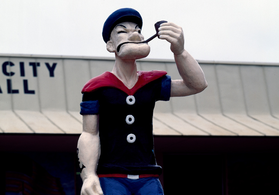 popeye statue a statue of popeye smoking a pipe