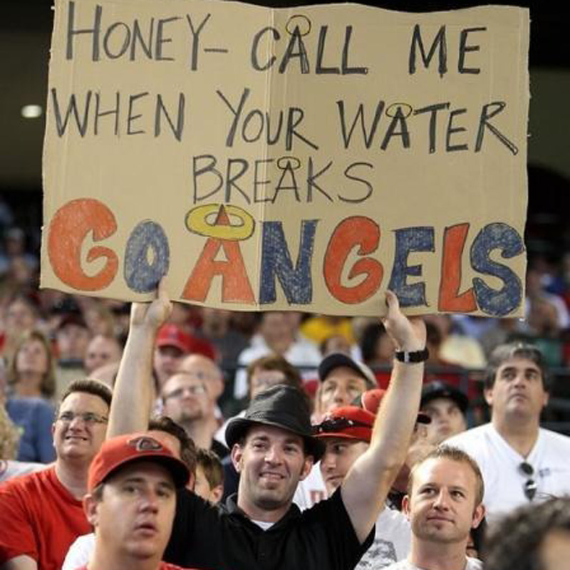 an angels fan with a sign for his wife