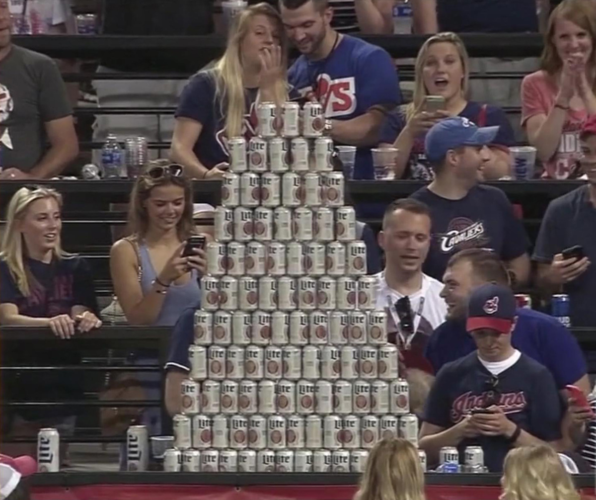 fans build a beer wall at a baseball game