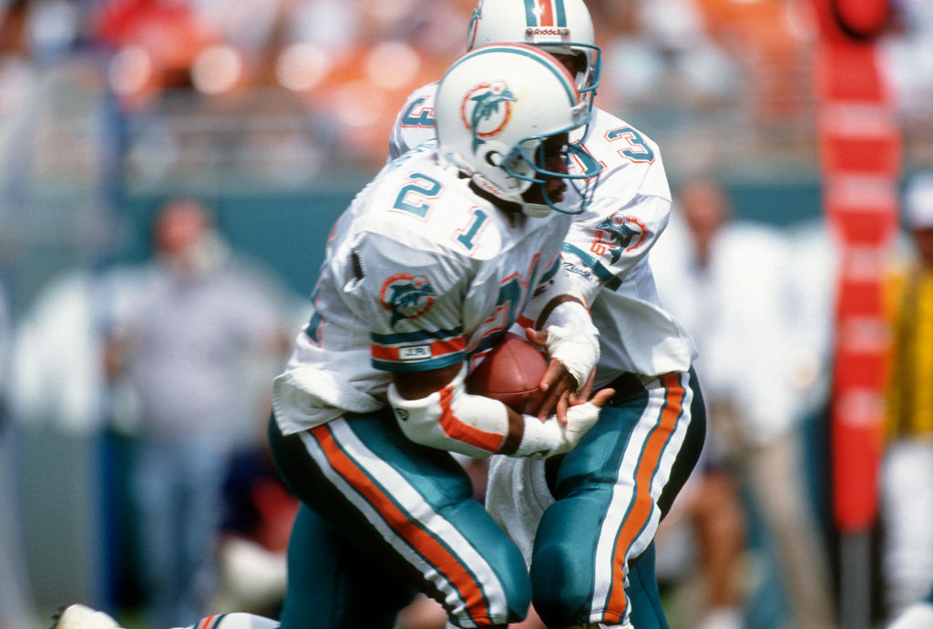 Which 90s coach led the Miami Dolphins to a perfect season in 1972?