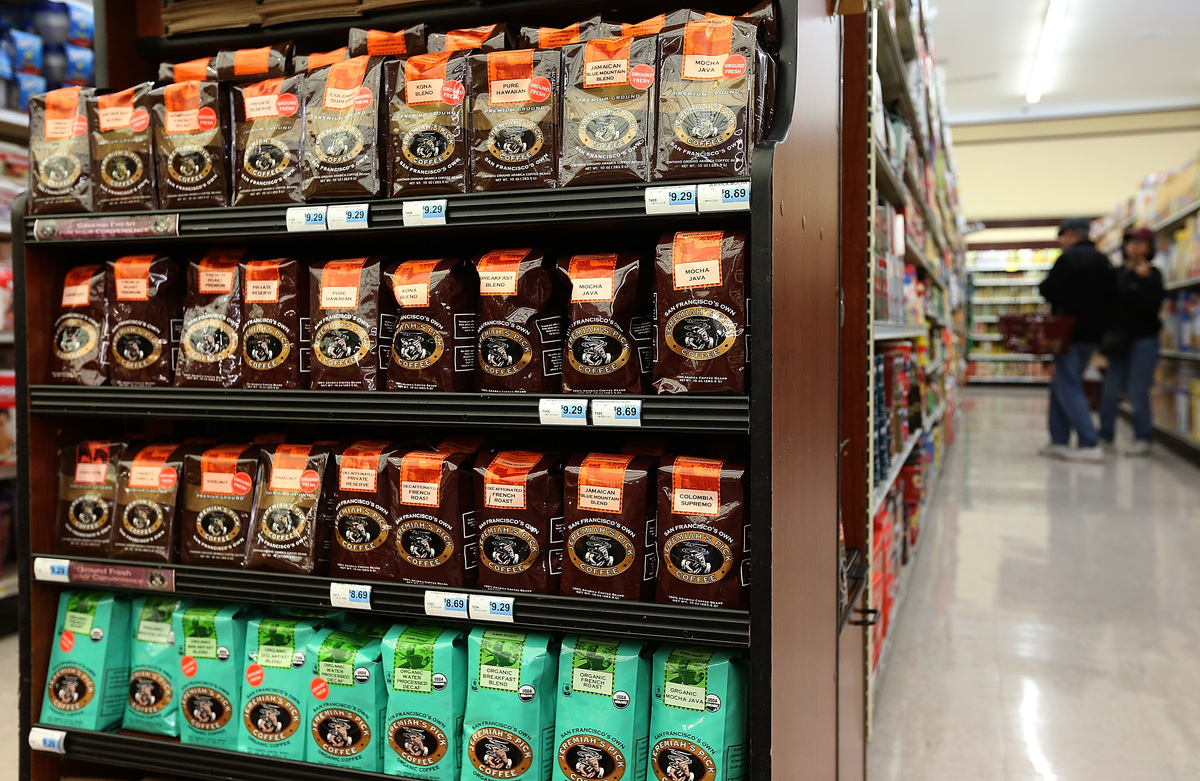 Packages of coffee beans are displayed at Cal-Mart Grocery