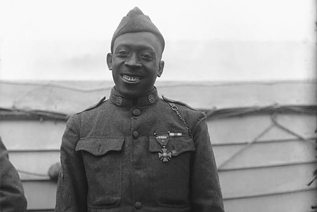 Johnson smiling at the camera 