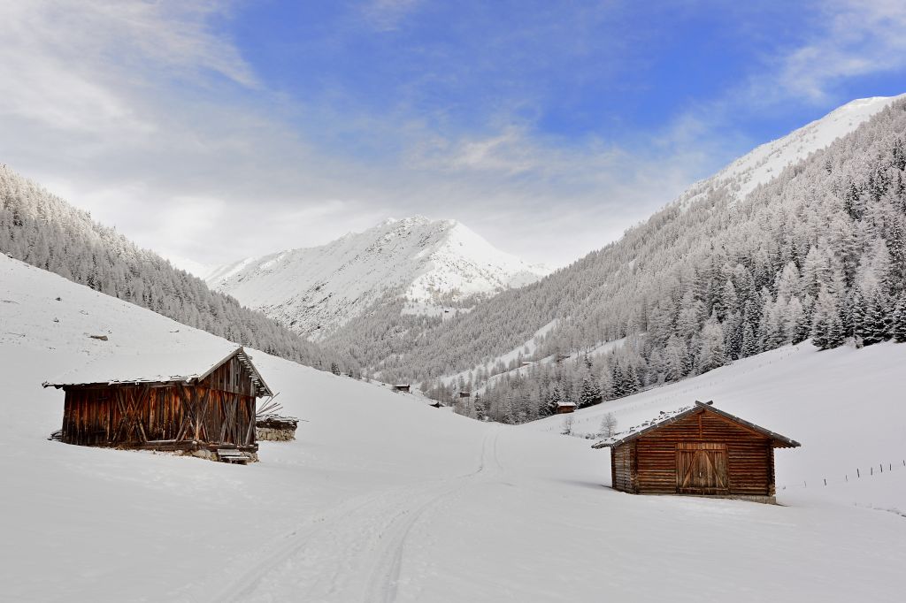 shacls built in the snow in the mountains