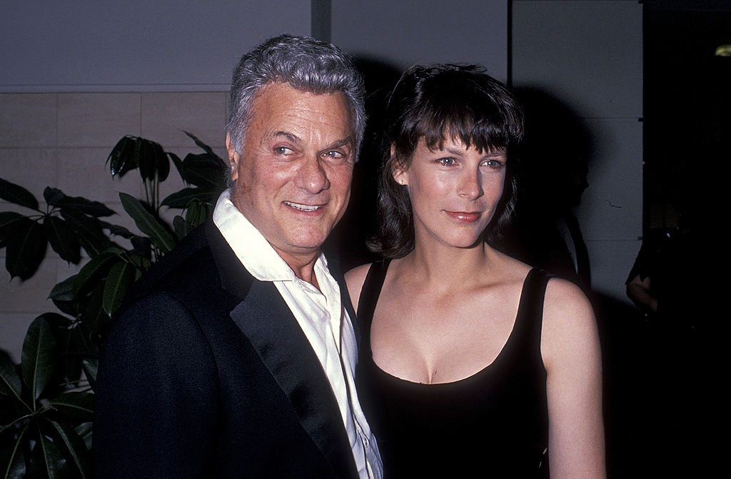 Jamie poses with her father at a dinner party circa 1989.