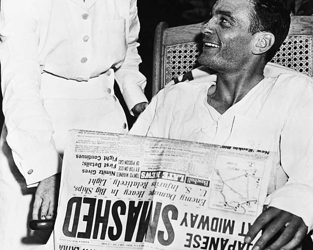 Man reading newspaper about the victory 