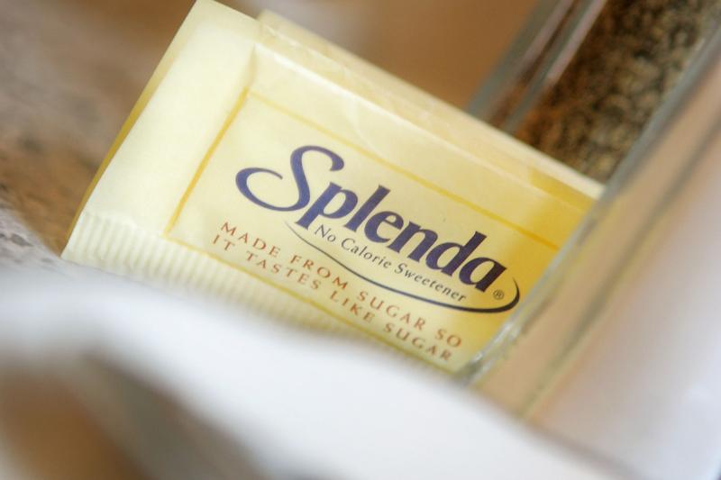 Packets of the popular sugar substitute Splenda are on a counter.