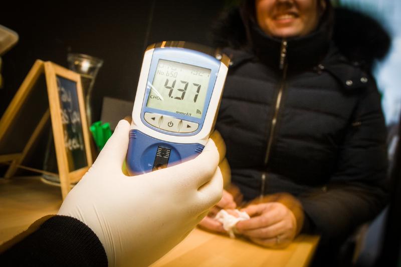 cholesterol test - 525439548 A man from the cholesterol foundation shows the result of a blood test for cholesterol screening.