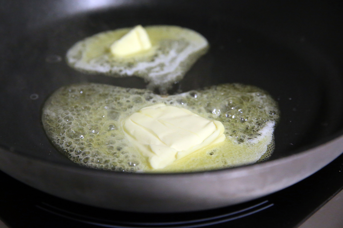 Butter fries in a pan, close-up.