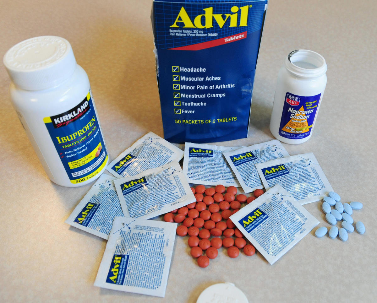 Anti-inflammatory pain relievers are laid out in packets and bottles.
