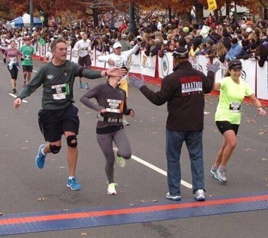 winner  someone high fiving someone but hitting someone in the face