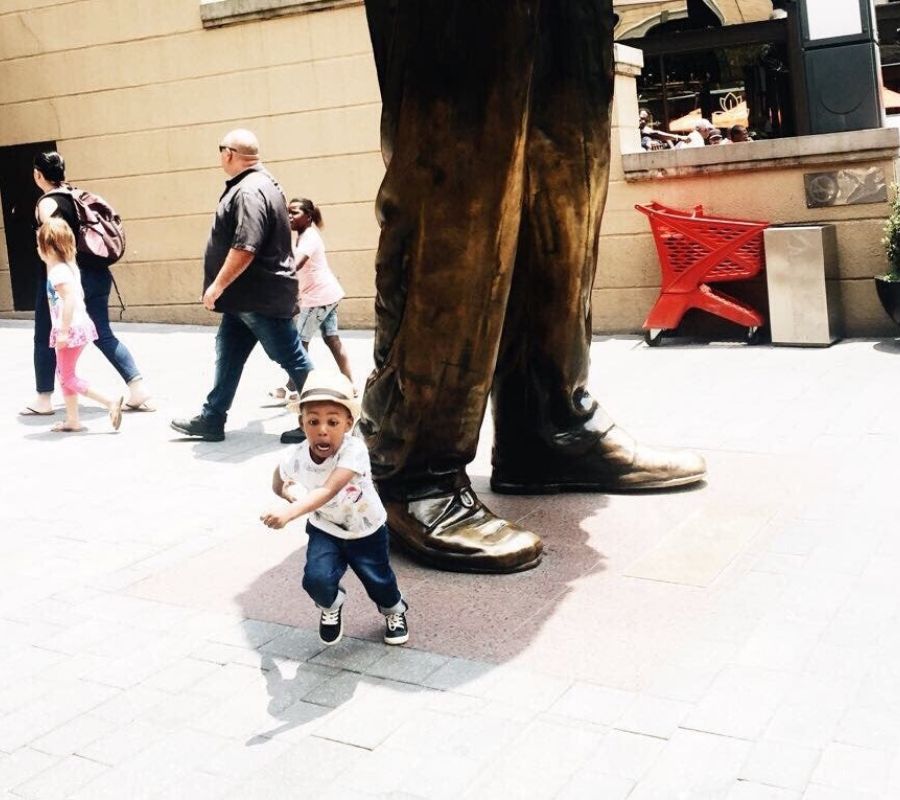 falling statue  a kid running away from a statue