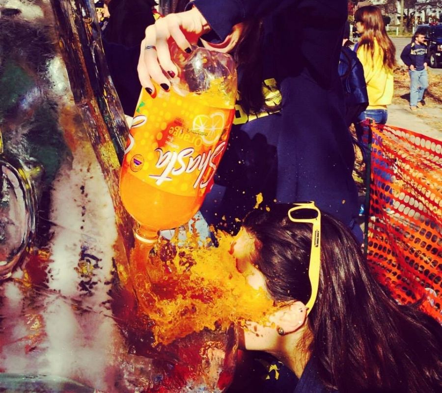 orange pop someone accidentally spilling pop on a person's face