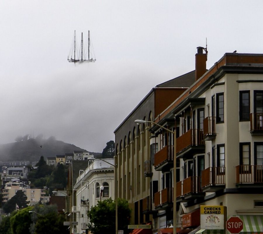 tower a tower that looks like it's a ship in the clouds