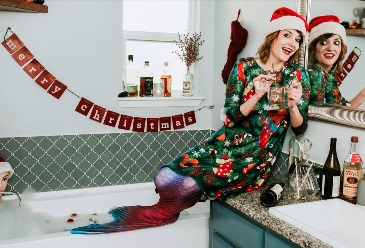 mess woman with mermaid tail looking generally chaotic