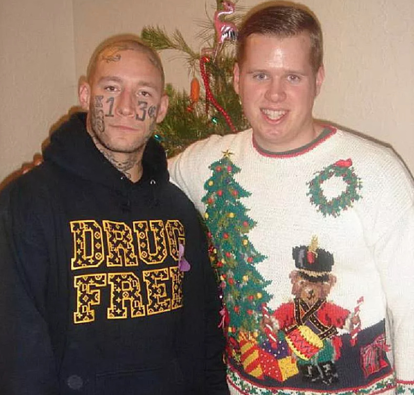 drug free one guy in christmas sweater while other wears hoodie that says