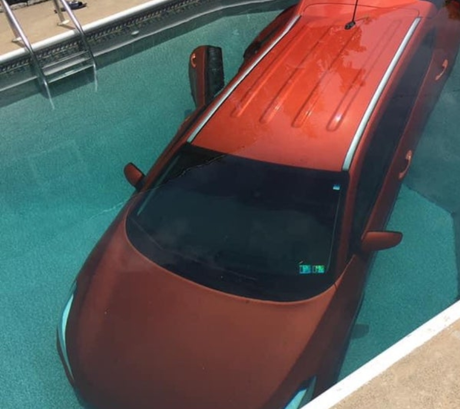 someone didn't put the brake on their car and it rolled into the pool