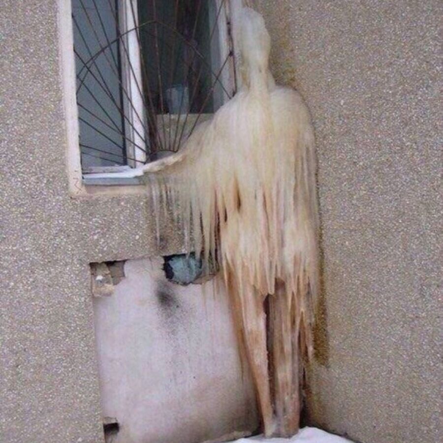 ice dripped down beside house to look like a human body 